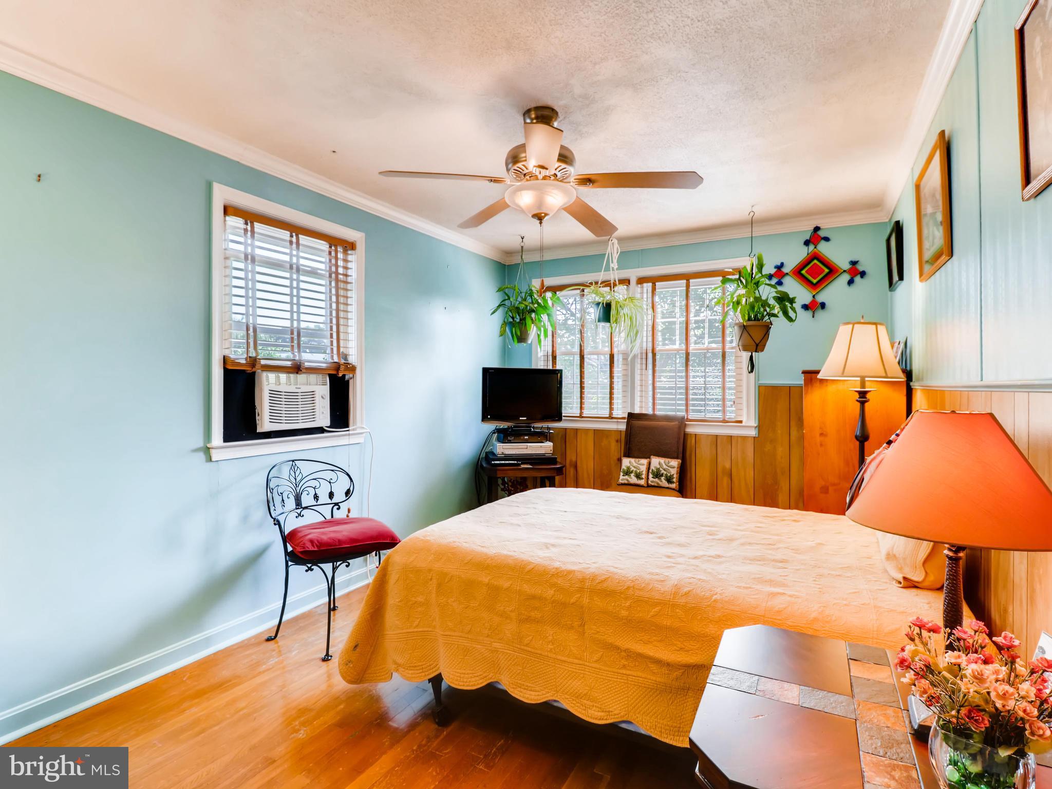 2207 Graythorn Road Baltimore, MD 21220 - Photo 21 of 30 a bedroom with a bed and a chandelier