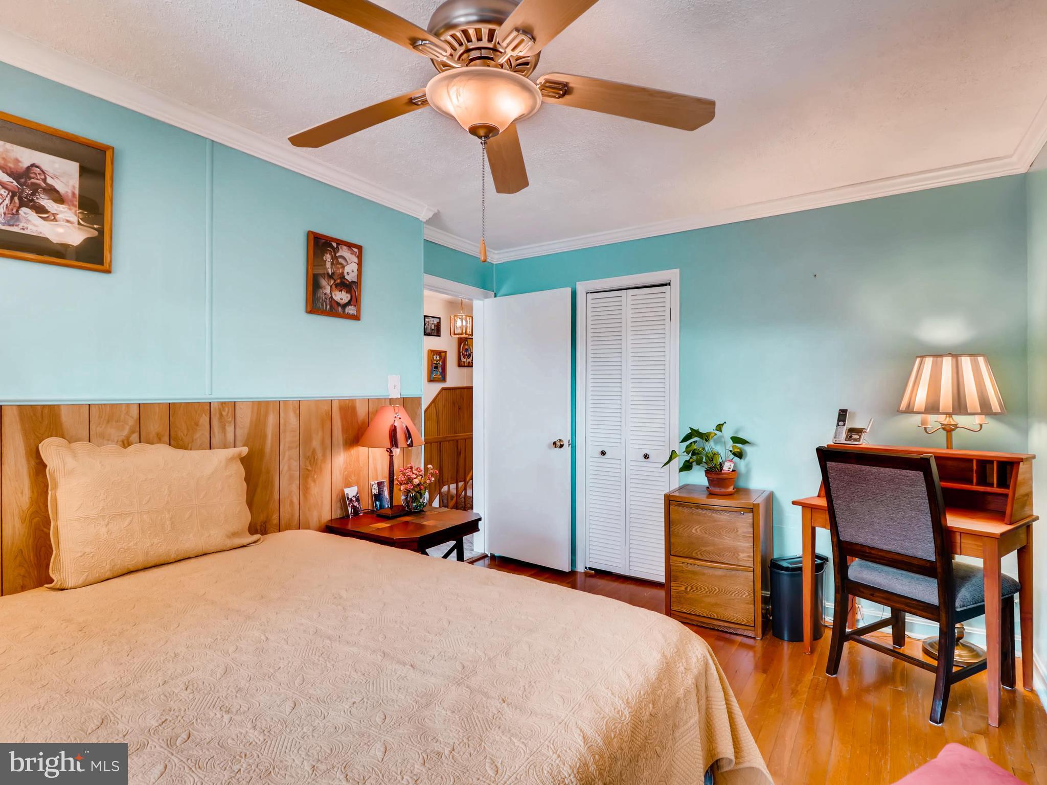 2207 Graythorn Road Baltimore, MD 21220 - Photo 22 of 30 a bedroom with a bed and a chandelier