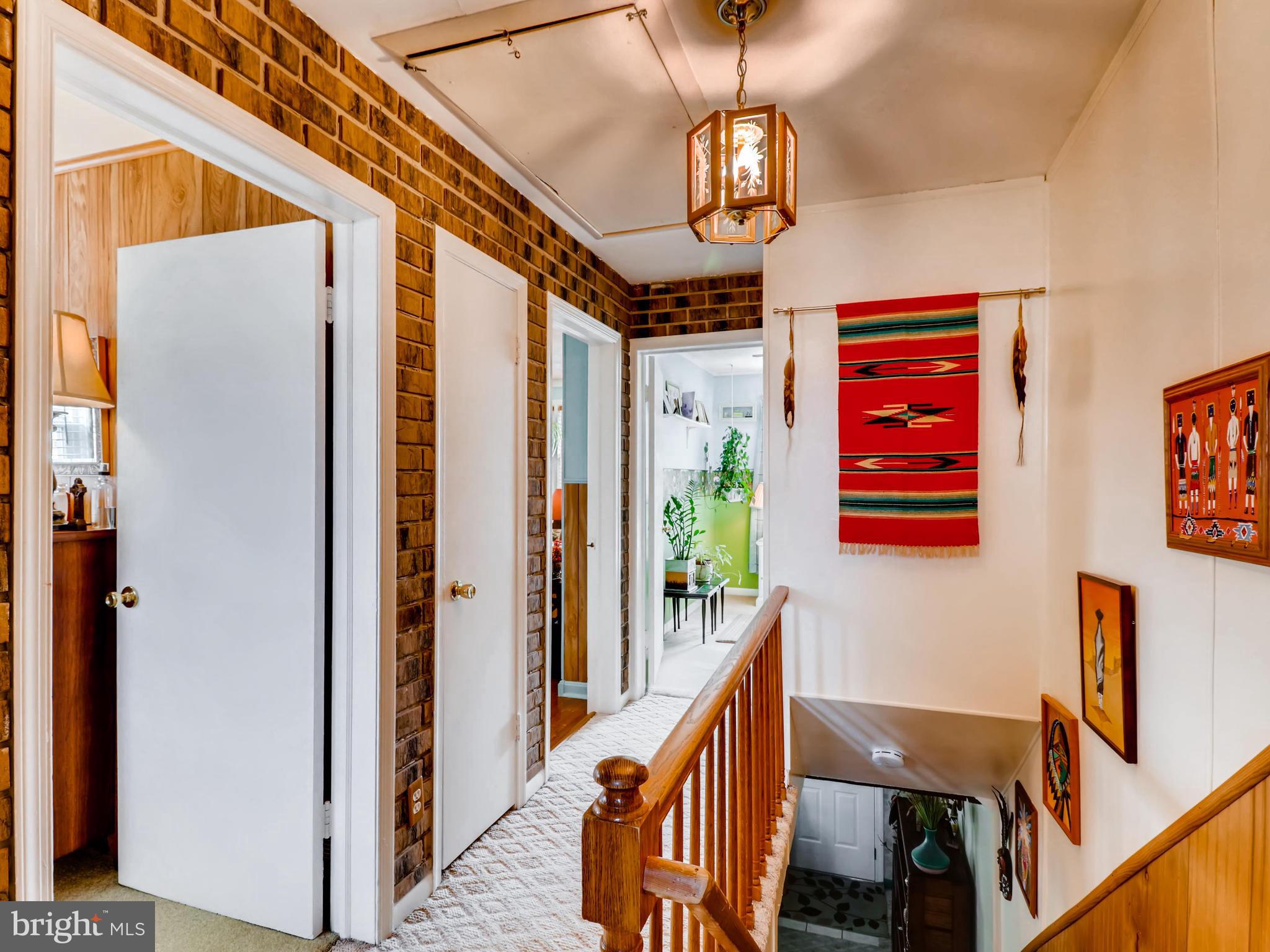 2207 Graythorn Road Baltimore, MD 21220 - Photo 23 of 30 a view of a hallway with wooden floor and staircase