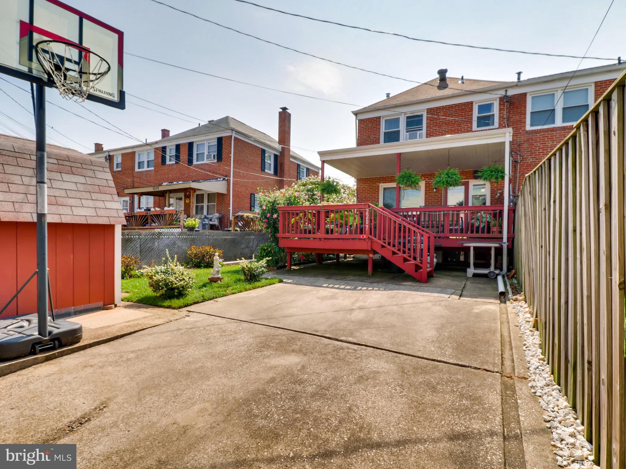 2207 Graythorn Road Baltimore, MD 21220 - Photo 28 of 30 a front view of a house with a garden and plants