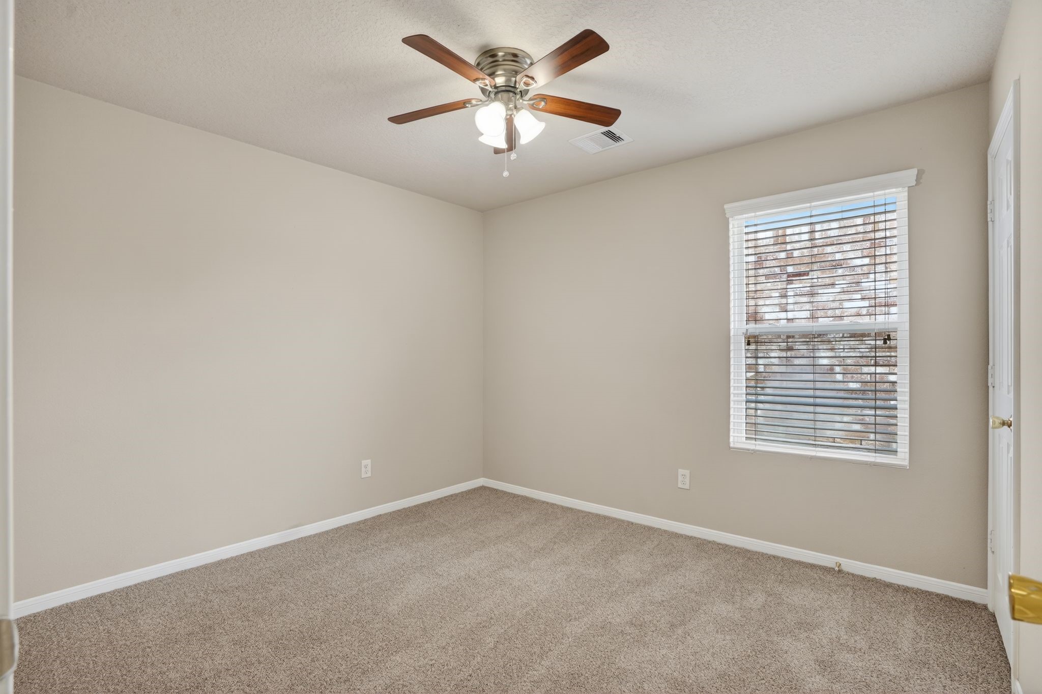 29414 Winton Wood Way Spring, TX 77386 - Photo 27 of 35 an empty room with a window and a fan