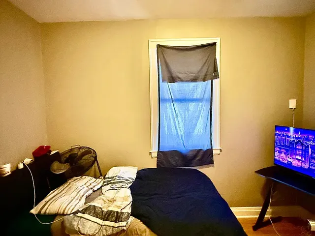 a bed room with furniture and a lamp