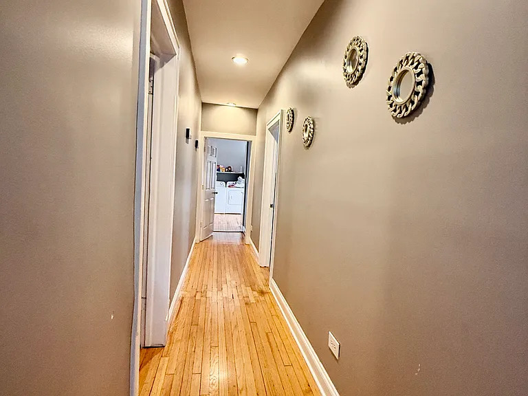 831 North Ashland Avenue, Unit 2 Chicago, IL 60642 - Photo 8 of 12 a view of a hallway with wooden floor