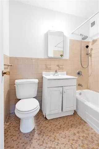 a bathroom with a sink a toilet and a bathtub