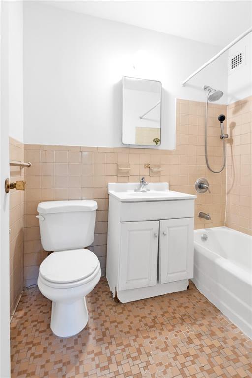2930 West 5th Street, Unit 2C Brooklyn, NY 11224 - Photo 18 of 21 a bathroom with a sink a toilet and a bathtub