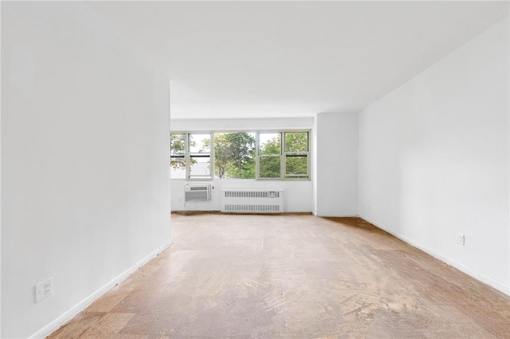 2930 West 5th Street, Unit 2C Brooklyn, NY 11224 - Photo 3 of 21 an empty room with large windows
