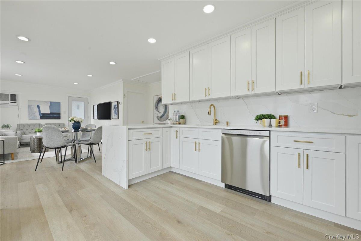 84 North Fordham Road Hicksville, NY 11801 - Photo 9 of 28 a kitchen with white cabinets and sink
