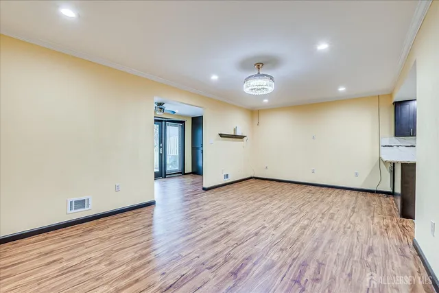 a view of a kitchen with wooden floor