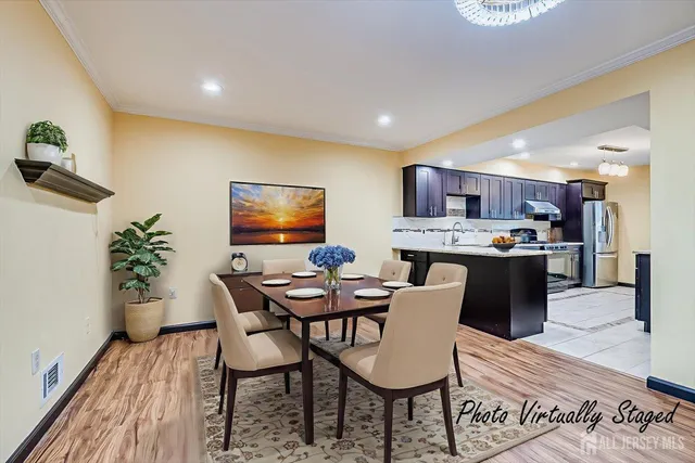 a kitchen with stainless steel appliances granite countertop a stove refrigerator and cabinets