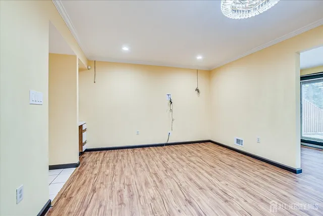 a kitchen with a refrigerator and a sink