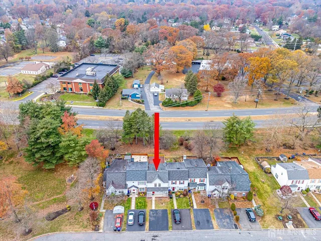 an aerial view of residential building and lake