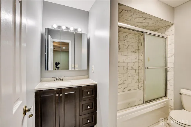 an empty room with a ceiling fan and fan