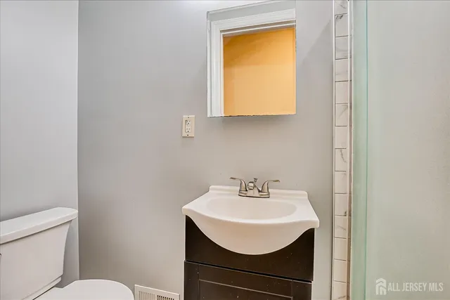 a view of swimming pool with wooden fence