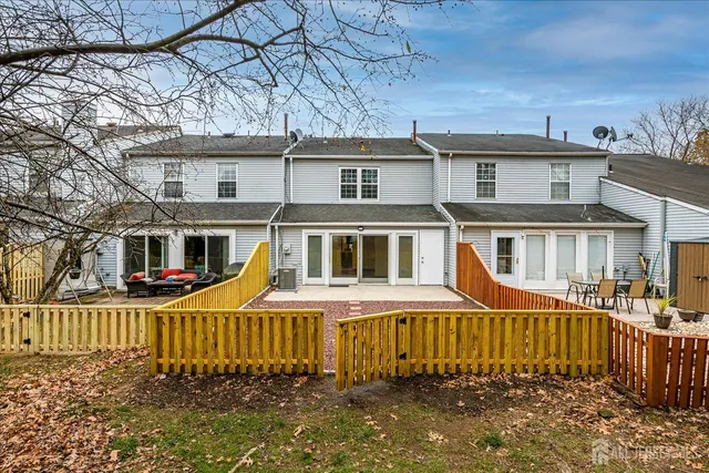 an aerial view of a swimming pool patio and outdoor seating