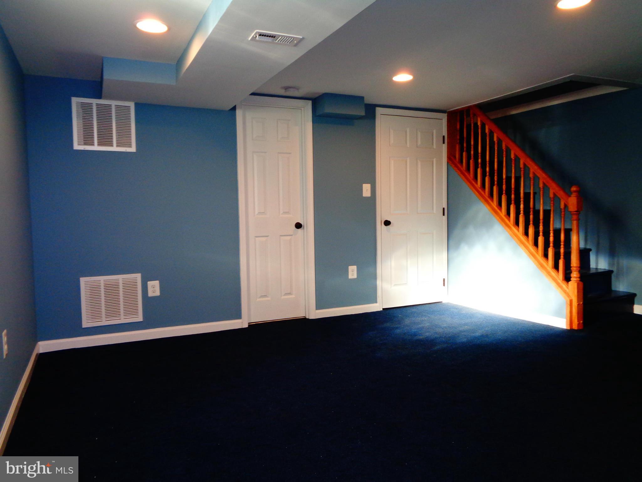 2109 Hawthorne Road Baltimore, MD 21220 - Photo 11 of 28 a view of an empty room with wooden floor