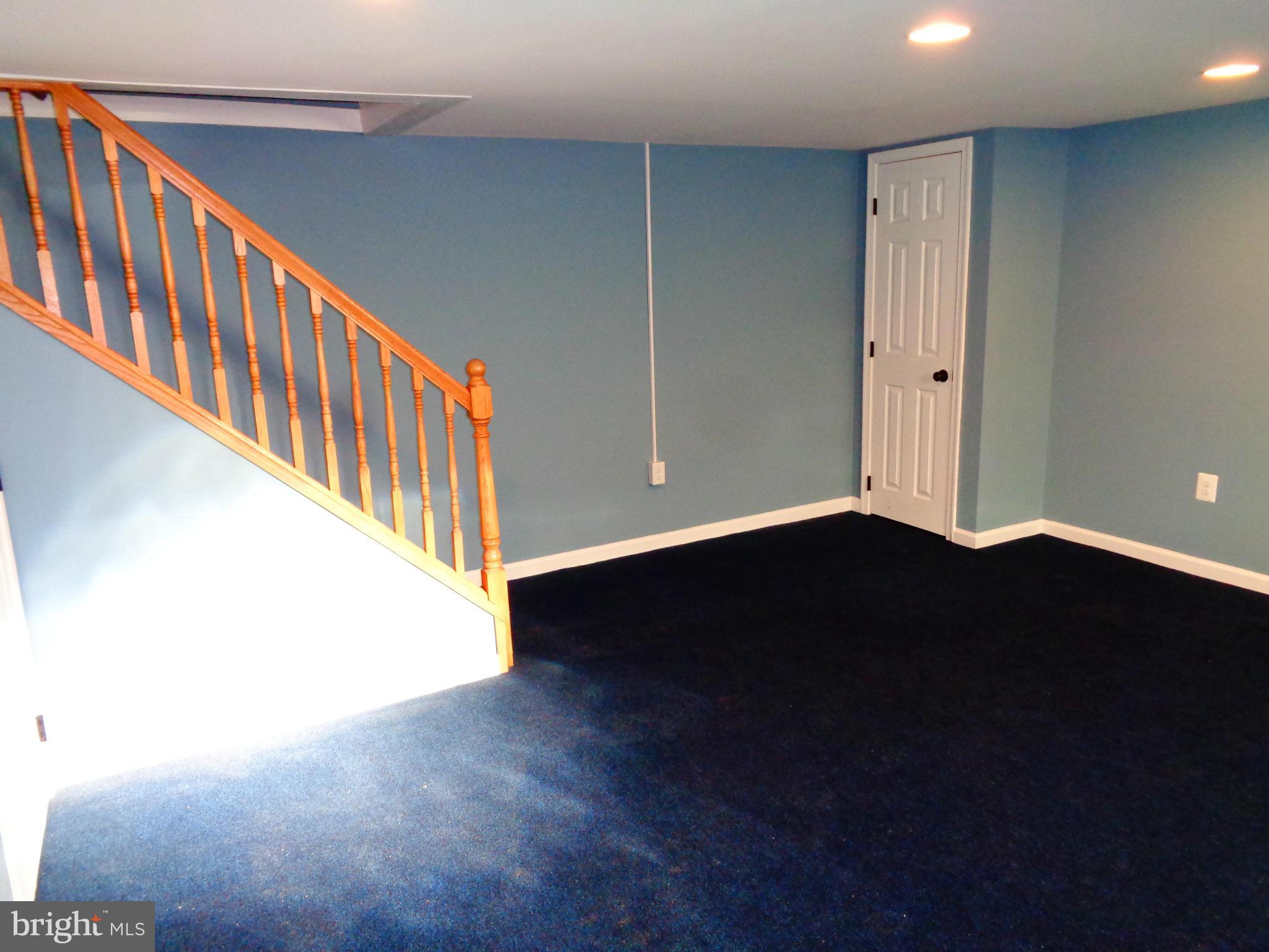 2109 Hawthorne Road Baltimore, MD 21220 - Photo 12 of 28 a view of an empty room with wooden floor
