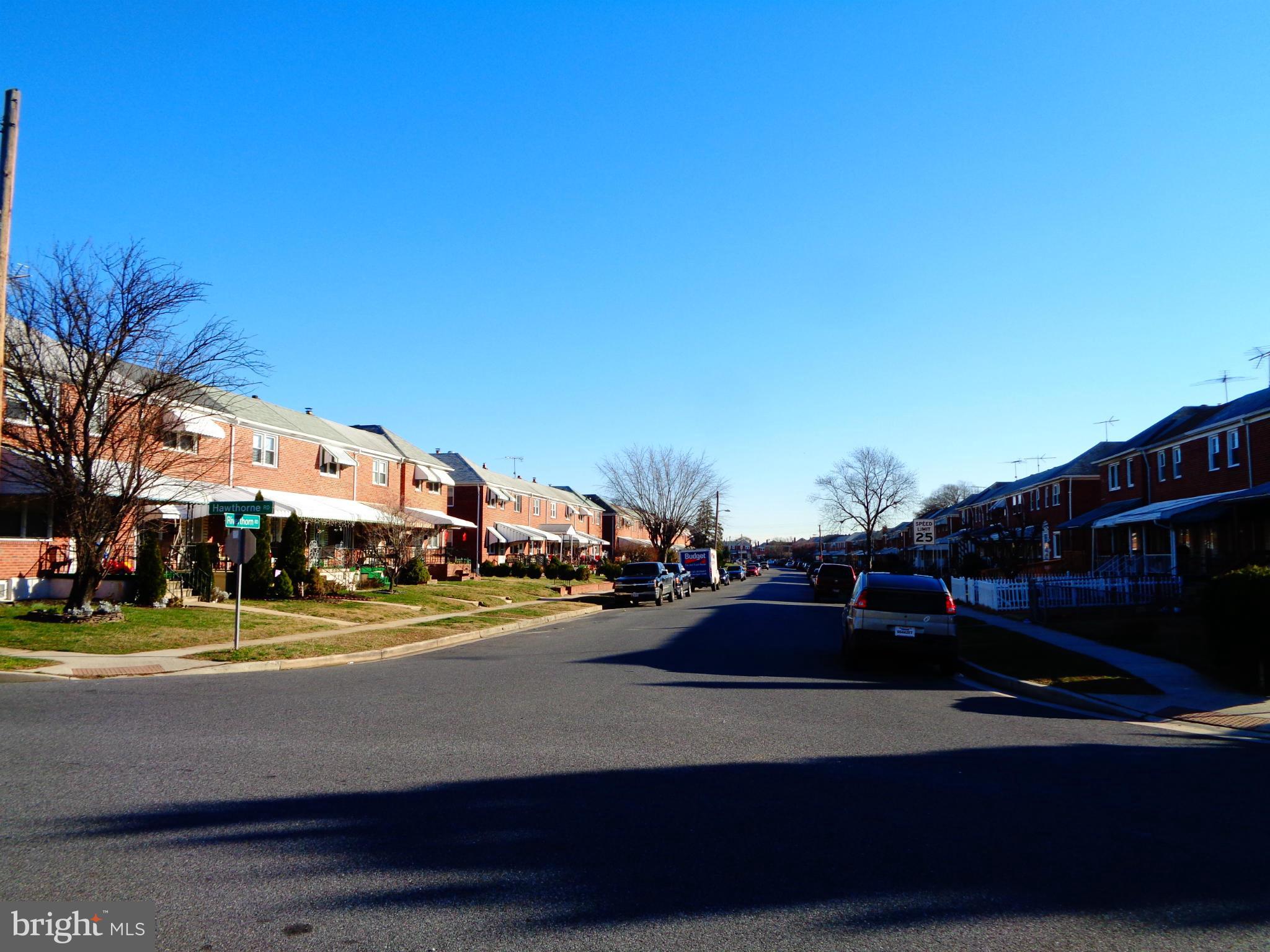 2109 Hawthorne Road Baltimore, MD 21220 - Photo 25 of 28 a view of street with cars parked on the roadside