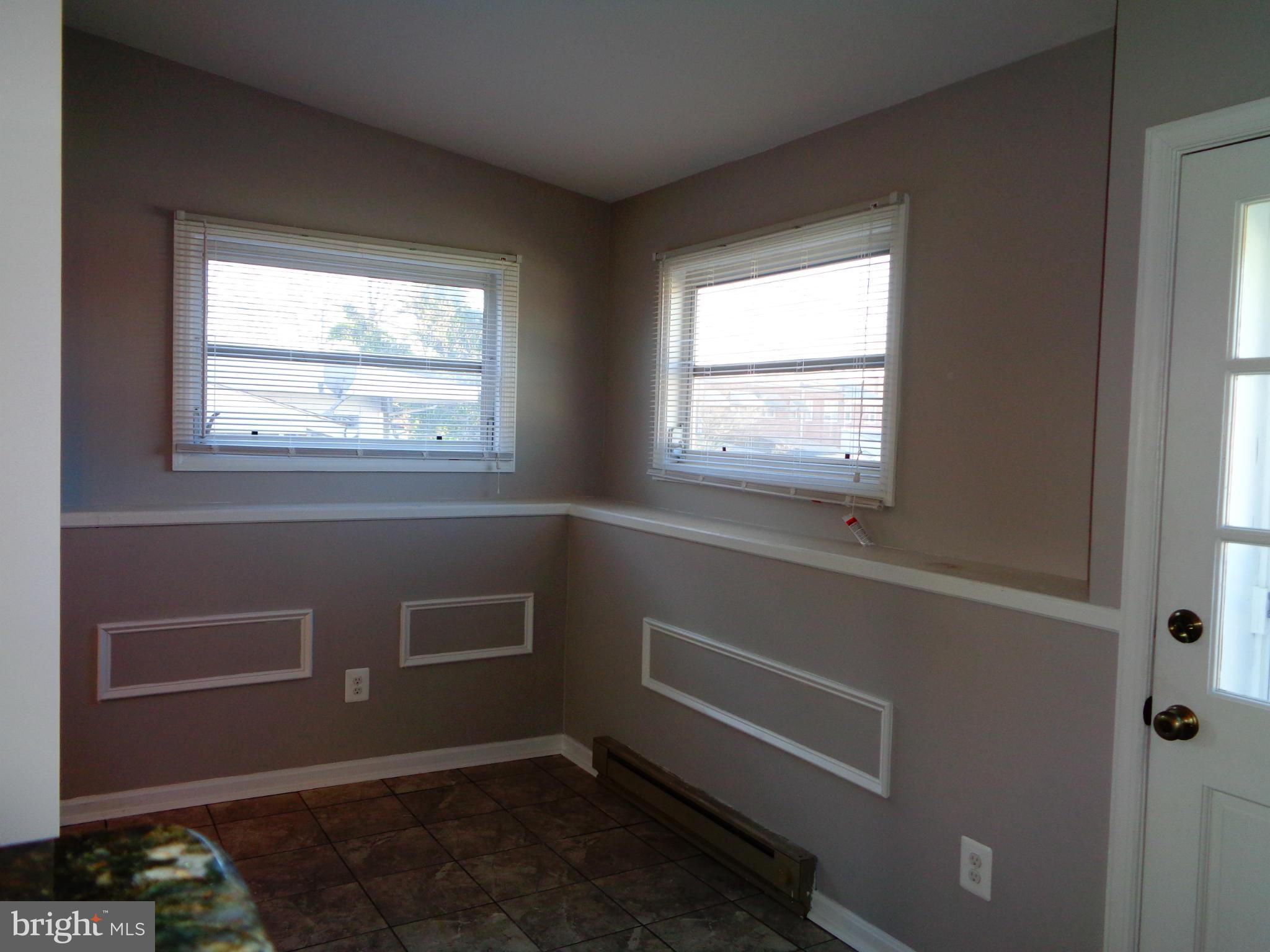 2109 Hawthorne Road Baltimore, MD 21220 - Photo 5 of 28 a room that has a window in it