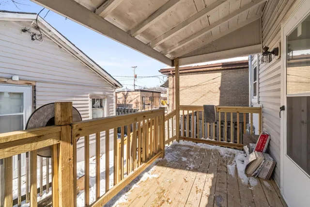 a view of a porch with wooden floor