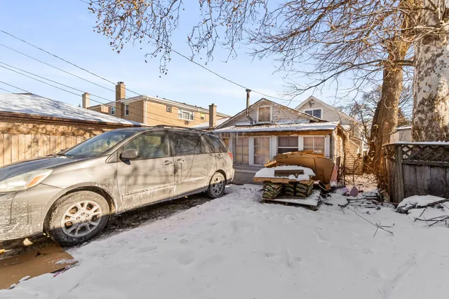 a car parked in front of a house