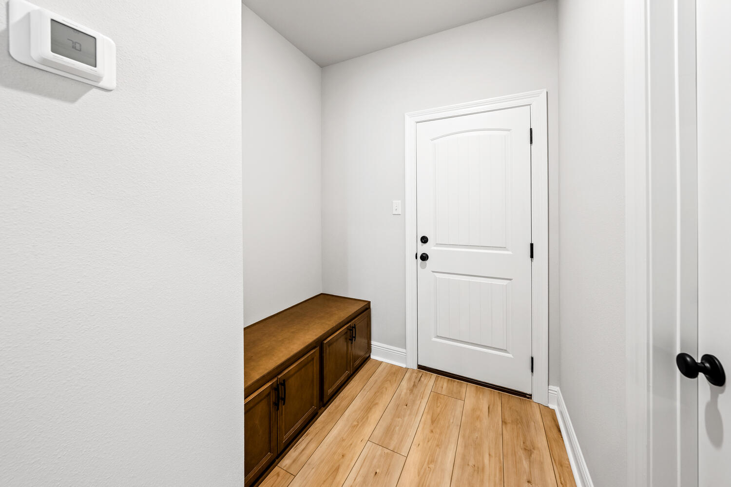 2737 Louis Circle Crestview, FL 32536 - Photo 17 of 21 a view of a hallway with wooden floor and staircase