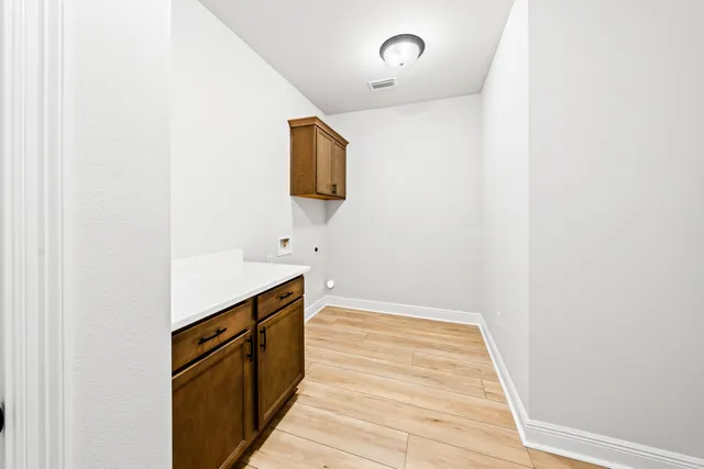 a kitchen with a sink and a microwave