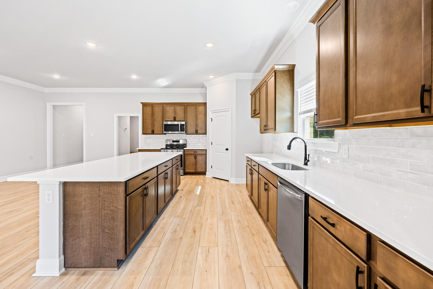 2737 Louis Circle Crestview, FL 32536 - Photo 5 of 21 a kitchen with stainless steel appliances a sink stove and cabinets