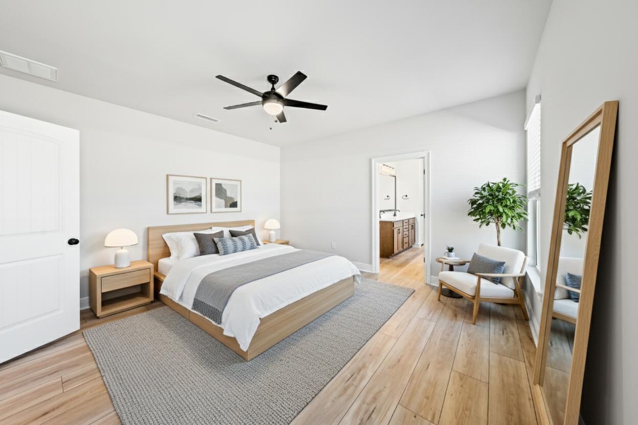 2737 Louis Circle Crestview, FL 32536 - Photo 6 of 21 a bedroom with a bed and a potted plant