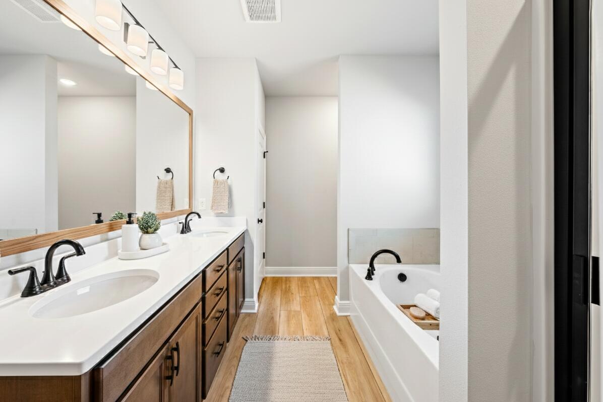 2737 Louis Circle Crestview, FL 32536 - Photo 8 of 21 a bathroom with a double vanity sink and a bathtub