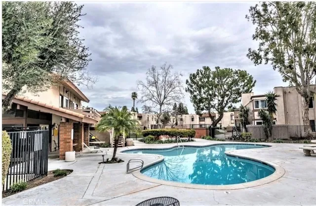 a view of outdoor space with swimming pool and furniture