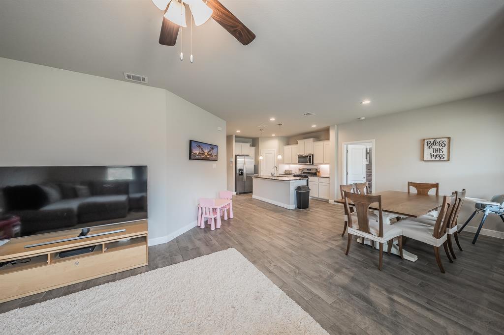 1212 Bosque Lane Weatherford, TX 76087 - Photo 13 of 38 a living room with furniture and a flat screen tv