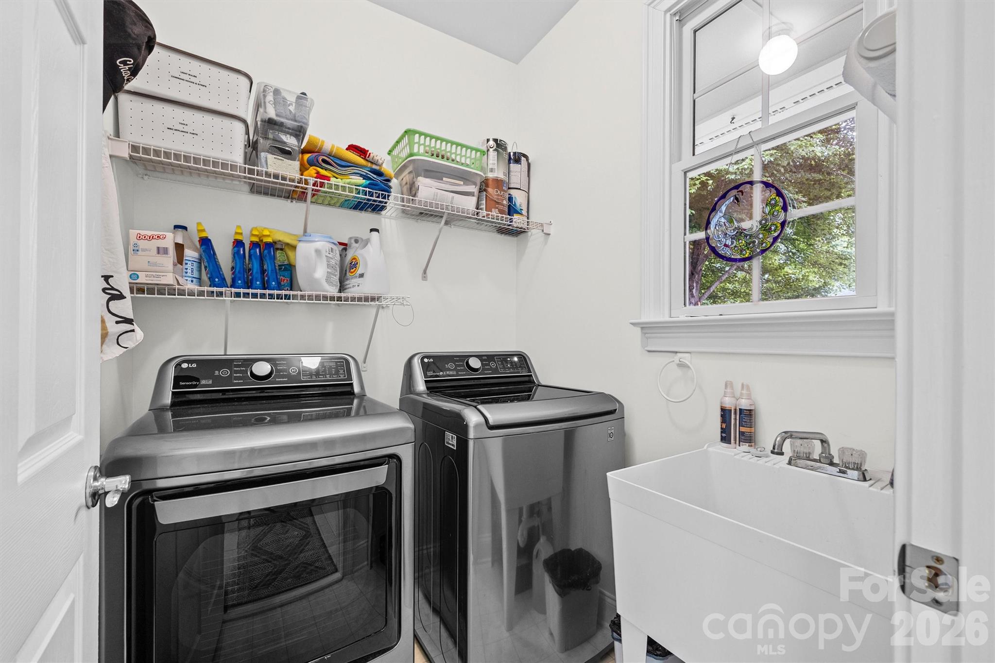 2578 Lower Assembly Drive Fort Mill, SC 29708 - Photo 20 of 28 a view of a storage and utility room with washer and dryer