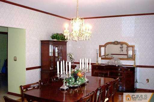 2 Maher Road Somerset County, NJ 08873 - Photo 3 of 8 a view of a dining room with furniture window and wooden floor