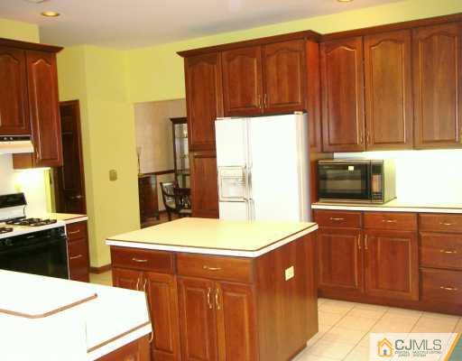2 Maher Road Somerset County, NJ 08873 - Photo 4 of 8 a kitchen with a sink cabinets and a refrigerator