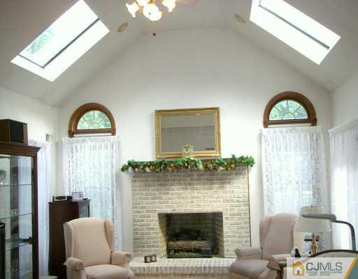 2 Maher Road Somerset County, NJ 08873 - Photo 5 of 8 a living room with furniture and a fireplace
