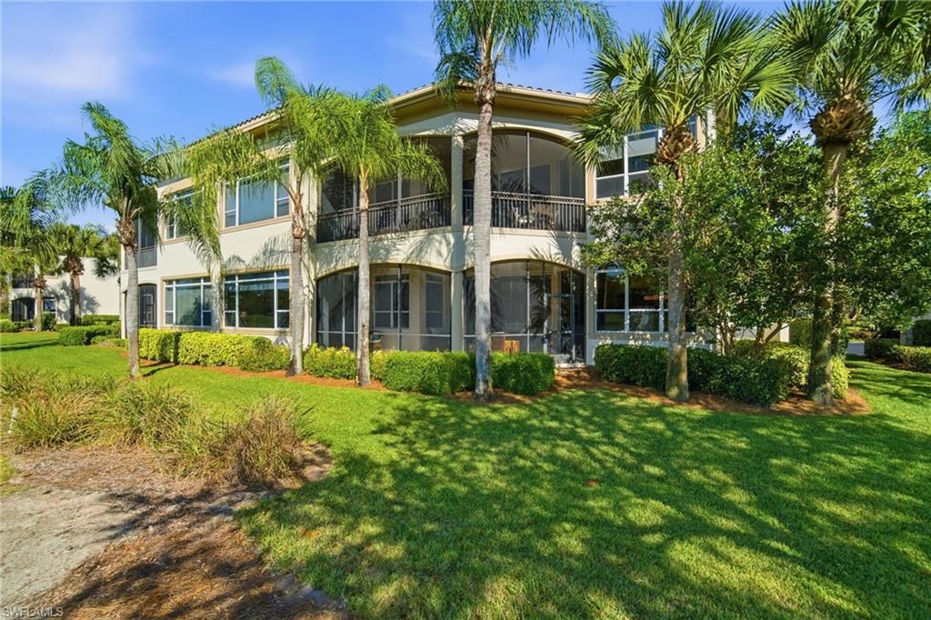 17015 Porta Vecchio Way, Unit 101 Naples, FL 34110 - Photo 25 of 39 a view of a building with a garden