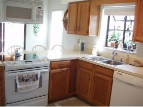 937 Northeast Ripley Palm Bay, FL 32907 - Photo 4 of 12 a kitchen with a sink cabinets and a window