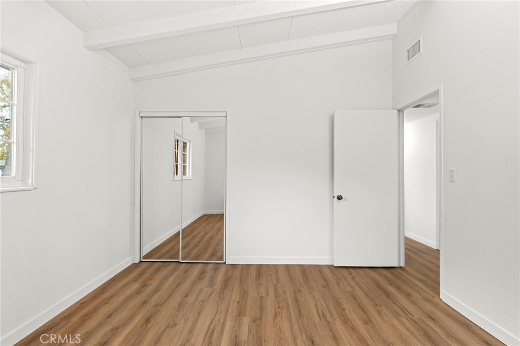 2344 Porter Way Chico, CA 95926 - Photo 23 of 35 a view of an empty room with wooden floor and a window