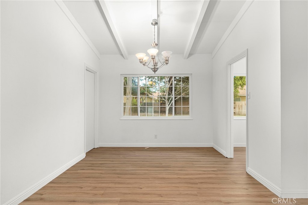 2344 Porter Way Chico, CA 95926 - Photo 3 of 35 a view of an empty room with wooden floor and a window