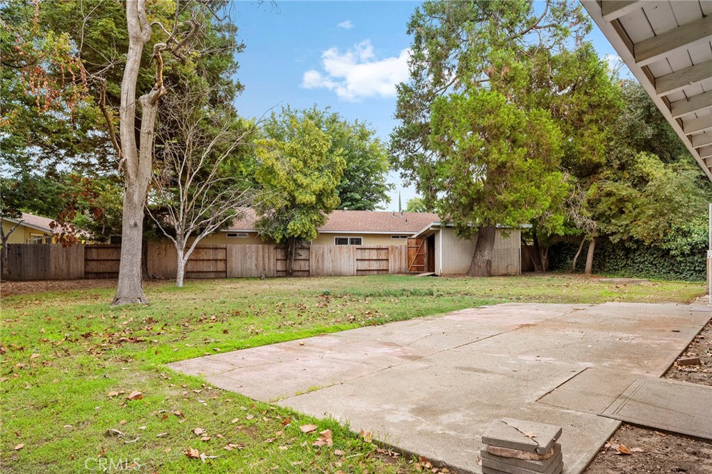 2344 Porter Way Chico, CA 95926 - Photo 6 of 35 a yellow house with trees in front of it
