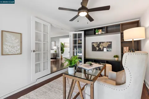 a kitchen with kitchen island granite countertop a sink a counter space appliances and cabinets