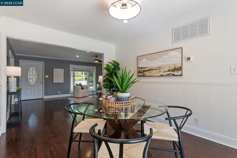 a kitchen with stainless steel appliances granite countertop a sink a microwave and a refrigerator