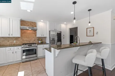 a living room with furniture flowerpot and a potted plant