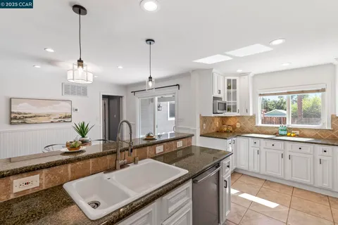 a bathroom with a double vanity sink mirror and shower