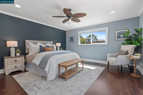 a view of wooden floor and windows in a room