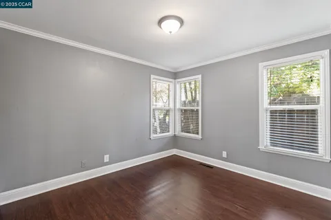 a view of backyard with swimming pool and furniture