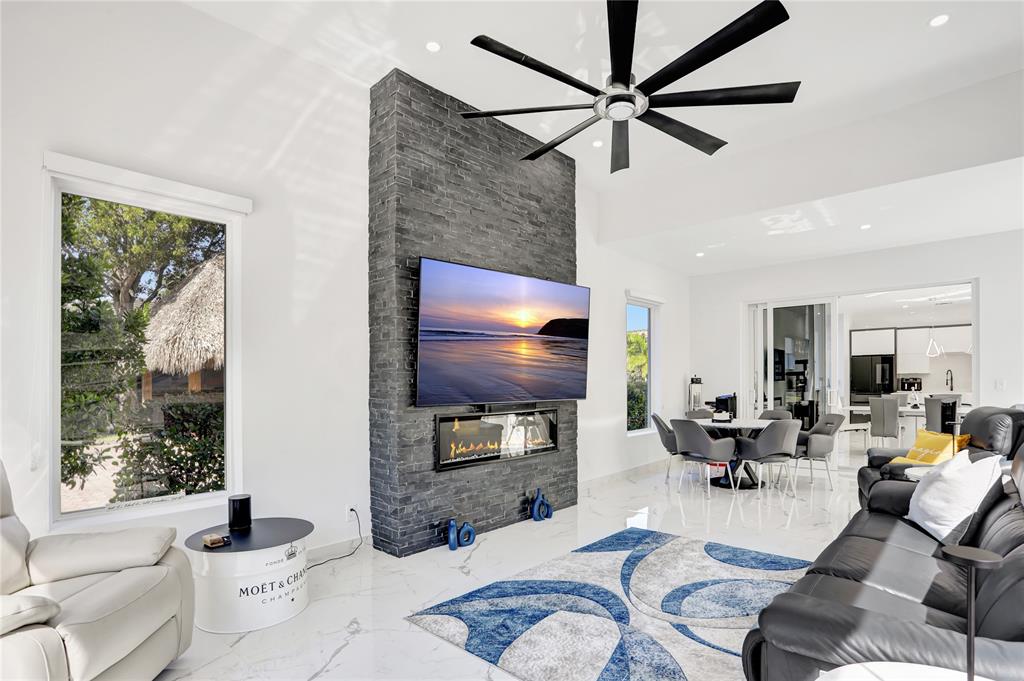 359 Sundial Circle, Unit 359 Margate, FL 33068 - Photo 1 of 36 a living room with furniture a ceiling fan and a window