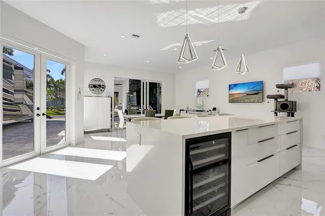 a kitchen with kitchen island cabinets and window