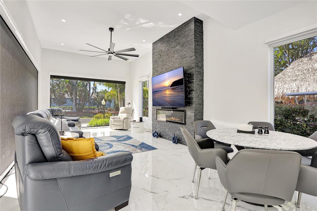 359 Sundial Circle, Unit 359 Margate, FL 33068 - Photo 12 of 36 a living room with furniture and a flat screen tv