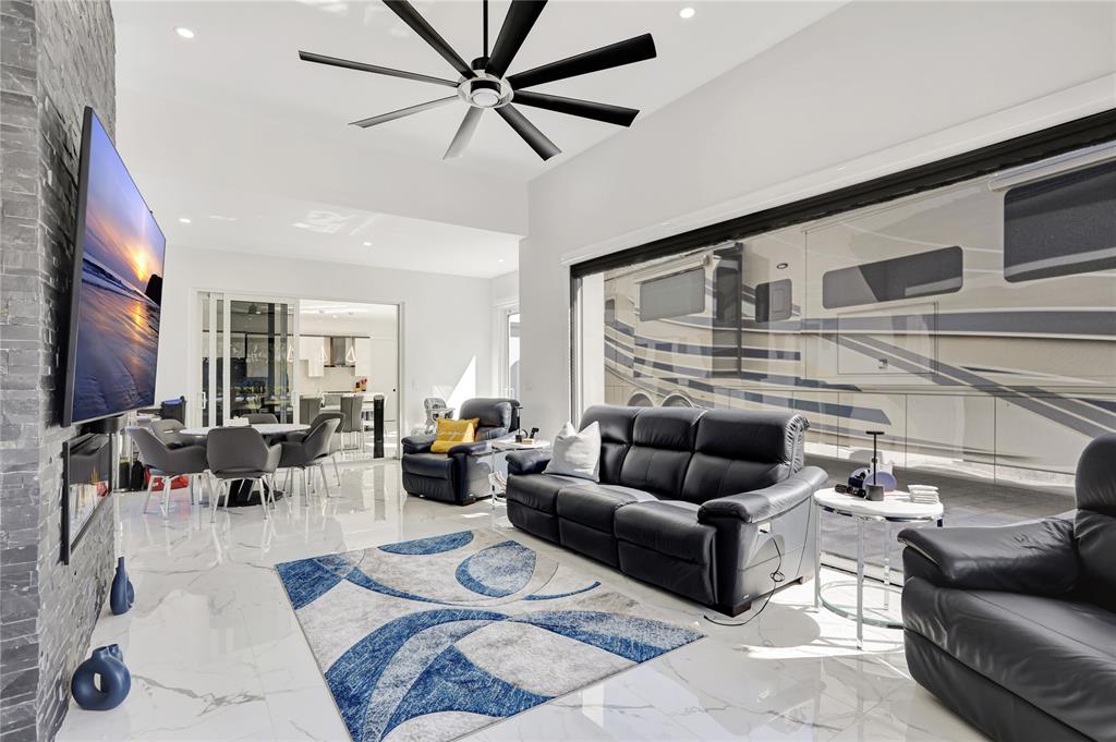 359 Sundial Circle, Unit 359 Margate, FL 33068 - Photo 13 of 36 a living room with furniture and a fireplace